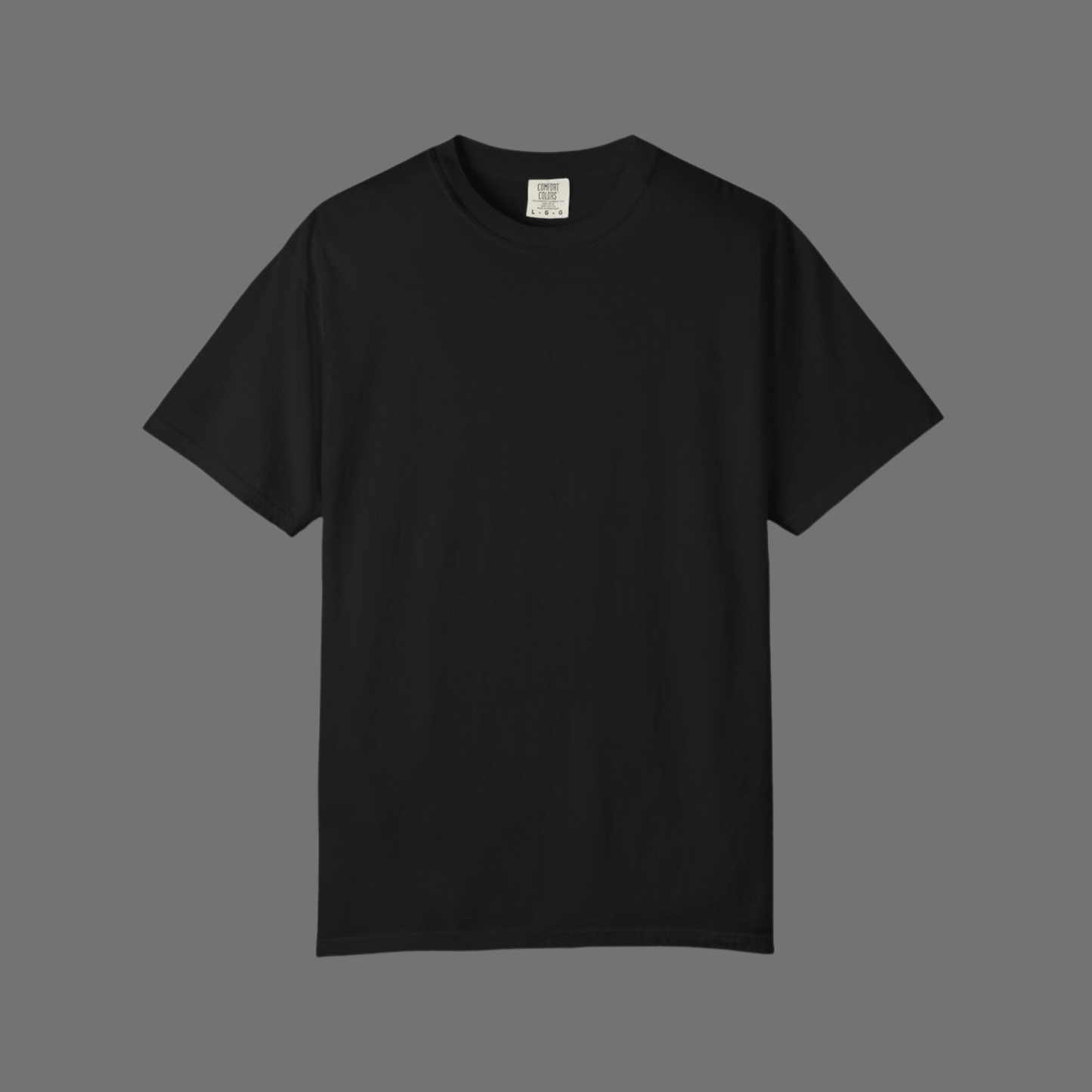 Flat lay of plain black Comfort Colors 1717 t-shirt with no visible print, shown on gray background